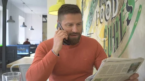 Happy, man talking by smartphone, looking at camera, portrait, cafe, steadicam Vídeo Stock 73230280