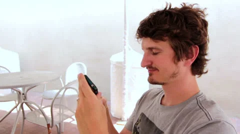 Happy man texting and missing someone Stock Footage 26338858