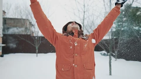 Happy man throwing snow up Stock Footage 170617790