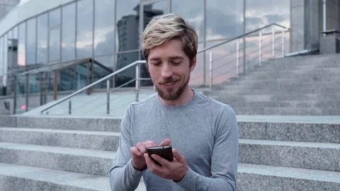 Happy man touch a smartphone Stock Footage 78733715