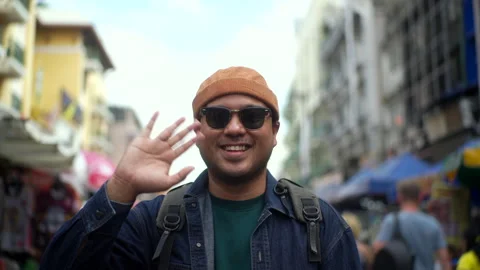 Happy man tourist looking at camera taking photo selfie video on smartphone. Stock Footage 295344863
