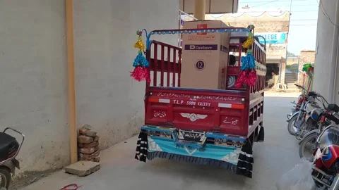 Happy Man Transporting Refrigerator In Auto Rikshaw Truck On Streets Of Pakistan Stock Footage 252129353
