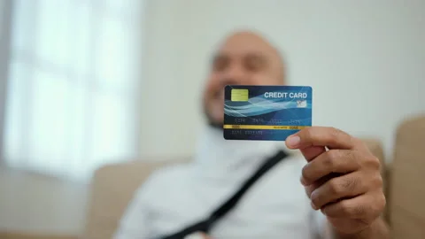 Happy man using credit card pay medical expenses from accident fracture broken. Stock Footage 221223206