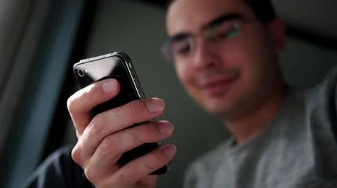 Happy Man Using His Smartphone Stockbeeldmateriaal 27067047