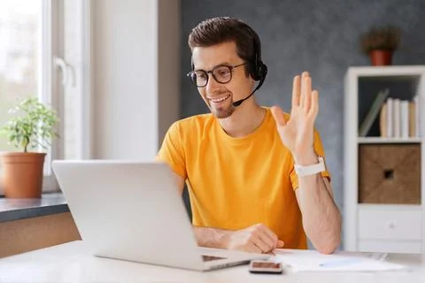 Happy man using laptop for distant learning Stock Photos