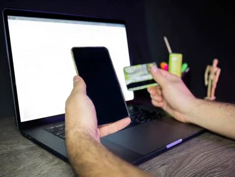  Happy Man using smart phone and credit card register payments online shopping Stock Photos