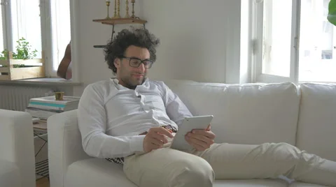 Happy man using tablet Stock Footage 51324068