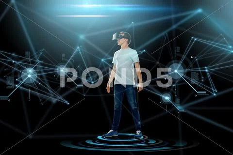 Happy man in virtual reality headset or 3d glasses Stock Photos