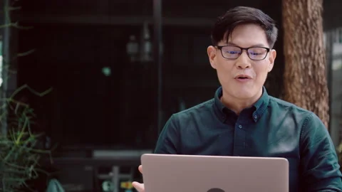 Happy Man Work at Home. Using laptop is meeting  video conference. Stock Footage 137214564