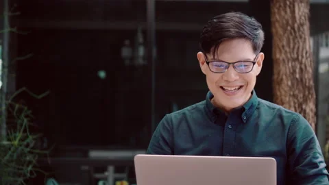 Happy Man Work at Home. Using laptop is meeting  video conference. Видео 137214615