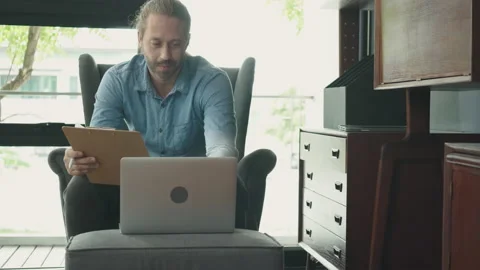 Happy Man Work at Home. Using a laptop is me Stock Footage 139936095