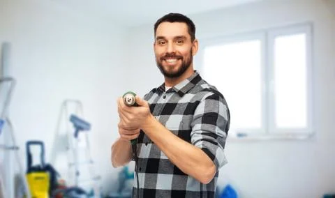 Happy man, worker or builder with drill Stock Photos