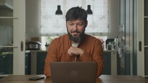 Happy man working on the laptop computer Stockbeeldmateriaal 196215381