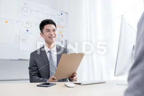 Happy man working in office Stock Photos