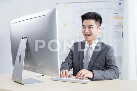 Happy man working in office Stock Photos