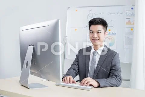 Happy man working in office Stock Photos
