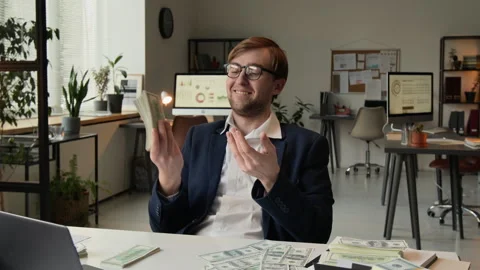 Happy Manager Bringing Stack of Banknotes to Ear Pretending He Speaking on Phone Stock Footage 331536569