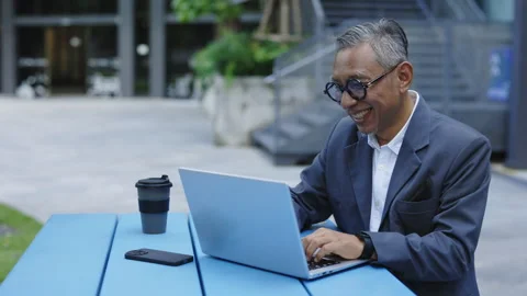 Happy Manager Using Laptop, Receiving Good News from Boss While Sitting Outside. Stock Footage 277070568