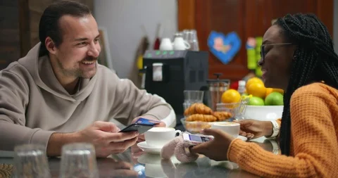 Happy married couple drinking coffee at home bar and shopping online Stock Footage 99320064