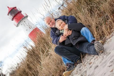 Happy mature couple relaxing baltic sea dunes Stock Photos