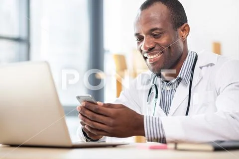 Happy medical worker reading news Stock Photos