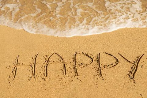 Happy  message on the sand Photos