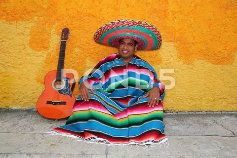 Happy mexican man typical sombrero serape guitar Stock Photos