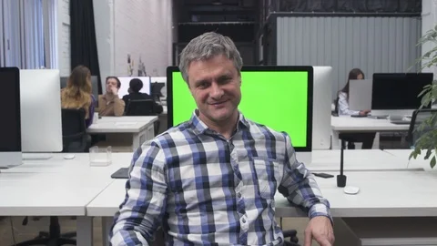Happy Mid-age Freelancer at Workplace in Big Office Stock Footage 105956025