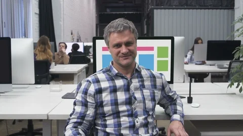 Happy Mid-age Web Designer Freelancer at Workplace in Big Office Stock Footage 106119514