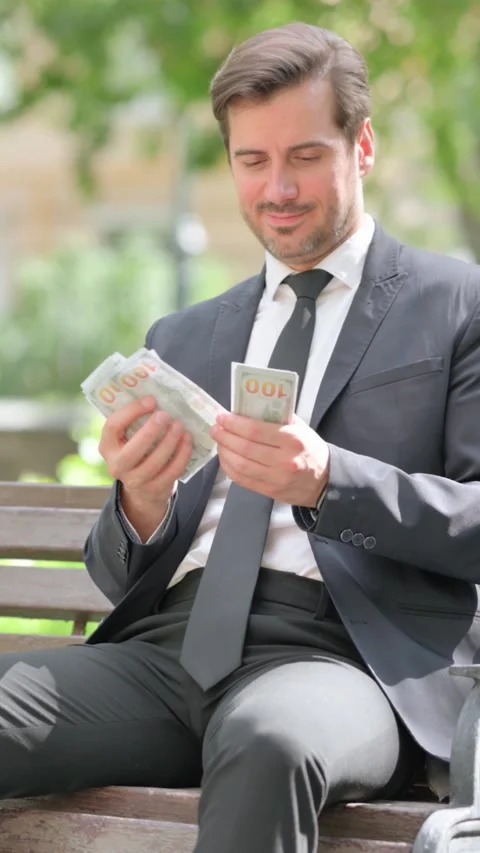 Happy Middle Aged Businessman Counting Money Outdoor 動画素材 319970828
