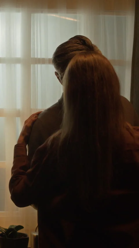 Happy Middle Aged Couple Slow Dancing Together by Window at Home Stock Footage 338377688