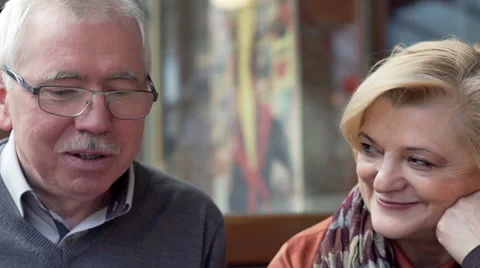 Happy, middle aged couple talking in cafe Stock Footage 59859371