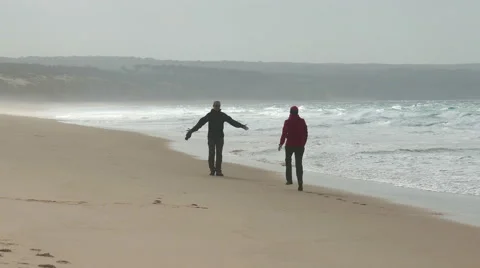 Happy Middle-aged Couple Walking on Beach Stock Footage 45507734