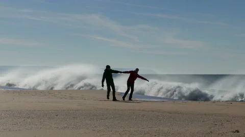 Happy Middle-aged Couple Walking on Beach Stock Footage 45577281