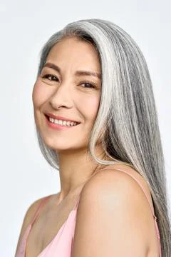 Happy middle aged mature asian woman portrait. Antiaging skincare ads. Stock Photos