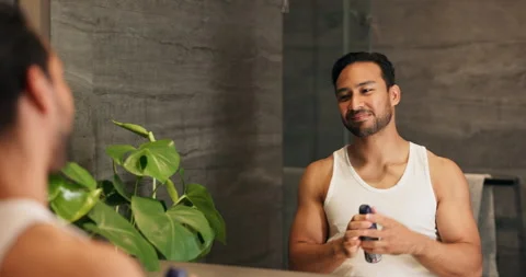Happy, mirror and man in bathroom with deodorant, antiperspirant and grooming. Vidéo 337152033