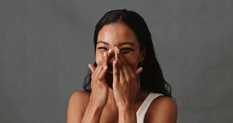 Happy mixed race female touching her face Stock Footage 200875662