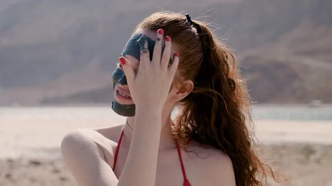 Happy model with dead sea mud close up 스톡 동영상 88065039