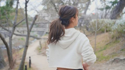 Happy model running through forest river in Japan run Stock Footage 105639132