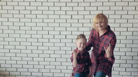 Happy mom and smiling son are having fun and fooling around, posing for a Stock Footage