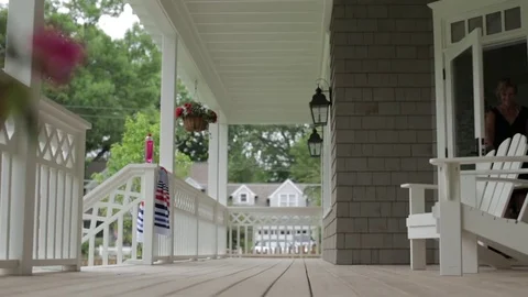 Happy mother and daughter leaving house Stock Footage