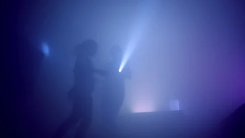 Happy mother having fun, dancing with adorable daughter holding flashlights Stock Footage 126859198