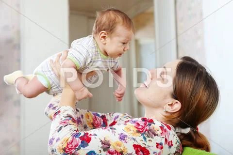 Happy mother with her baby Stock Photos