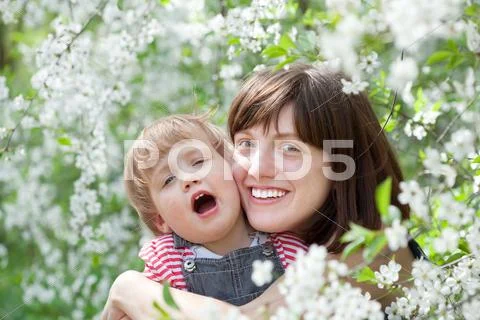 Happy mother with toddler in spring Stock Photos