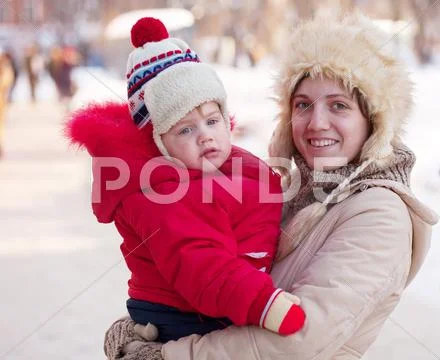 Happy mother with toddler in winter Stock Photos