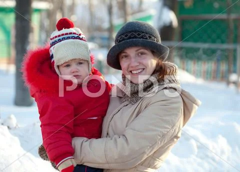 Happy mother with toddler in winter Stock Photos