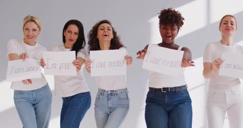 Happy multi ethnic group of successful confident women holding motivational Stock Footage 338248673