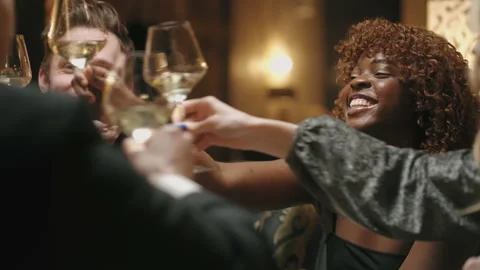 Happy multi ethnic people clinking glasses with champagne and celebrating Video stock 227937092