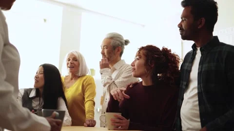 Happy multiethnic people drinking tea during lunch break at work  Stock Footage 247900920