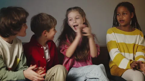 Happy multiracial classmates talking and clapping hands during lunch break Stock Footage 335685076
